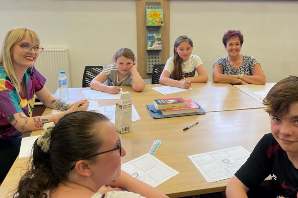 Deputy Minister joins children for creative writing as part of summer activities