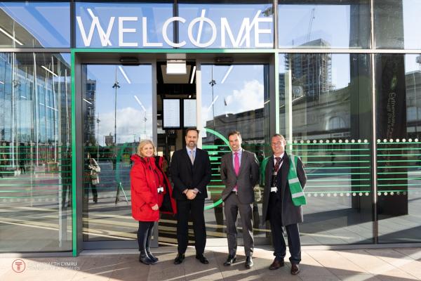 Photograph of Marie Daly, Chief Customer and Culture Officer for TfW, Craig Hampton-Stone, Managing Director Cardiff Bus, Ken Skates, Cabinet Secretary for Transport and North Wales, Gavin Hawkins, Bus Interchange Operations Manager, outside the bus interchange.